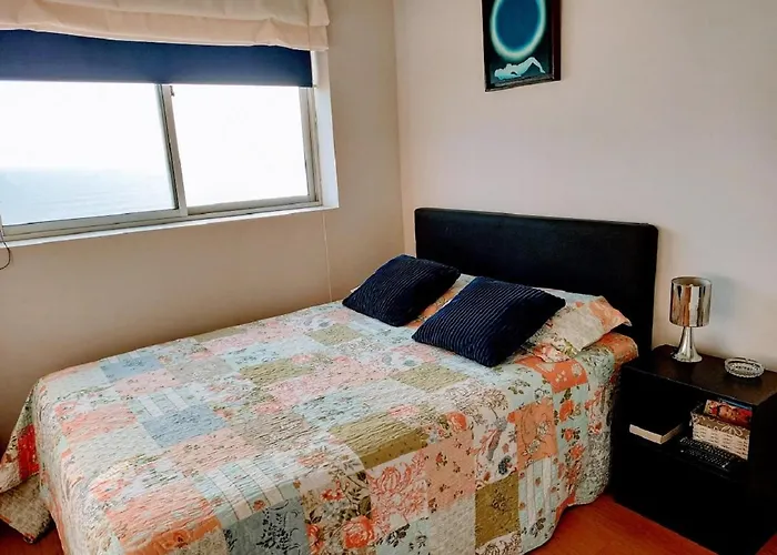 Habitación con vista al mar en casa de familia